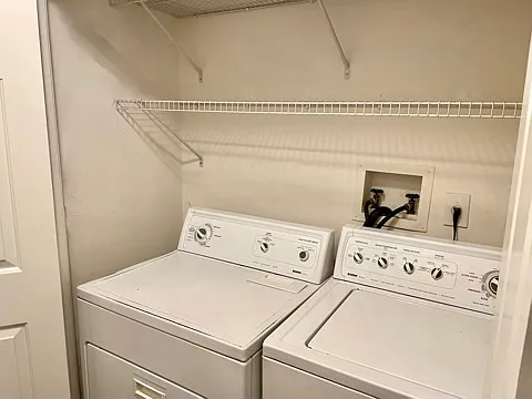 Laundry area next to lower level's bathroom.