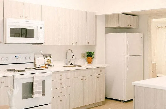 Kanekapolei Collection Kitchen Area with appliances and cabinets
