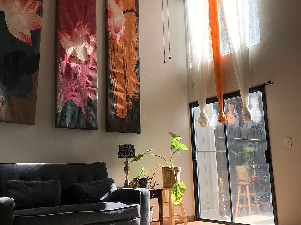 High ceiling with a fan.