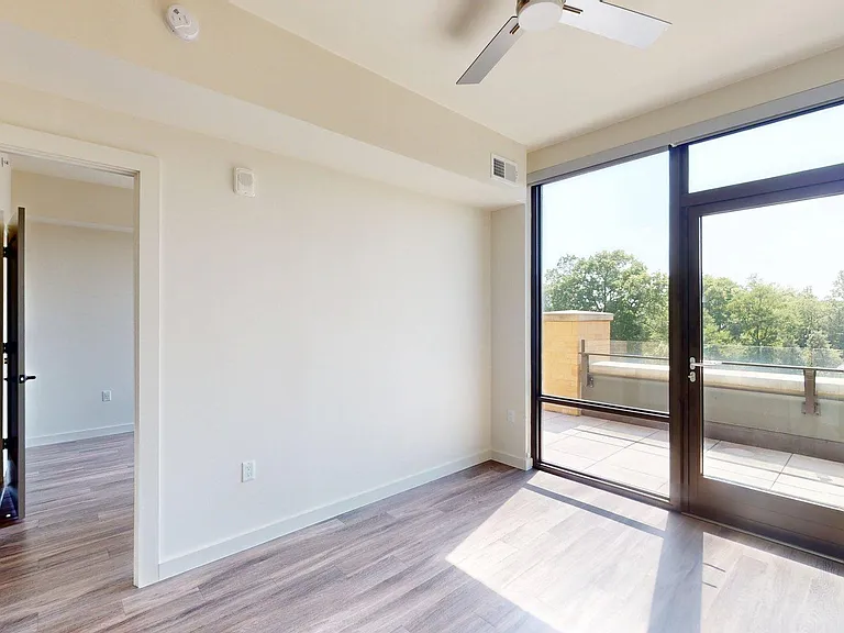 Apartment living room with wood style floor.