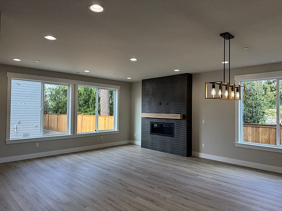 Great room with Gas fireplace & large windows