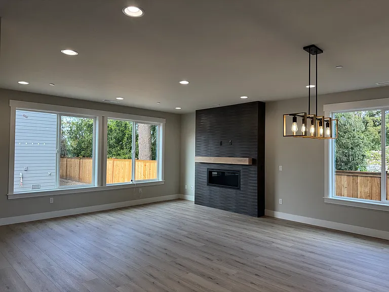 Great room with Gas fireplace & large windows