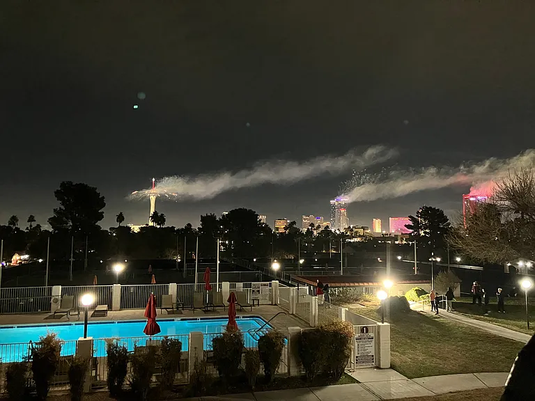 Community main pool during New Year's Eve fireworks on the Strip
