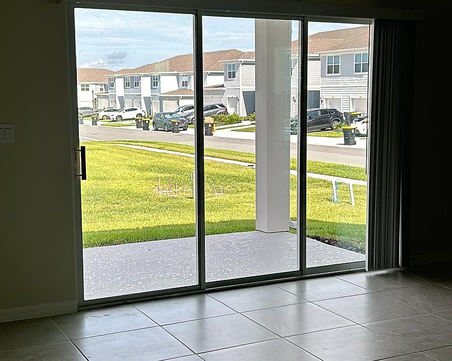 Three panels sliding door in the living room area.
