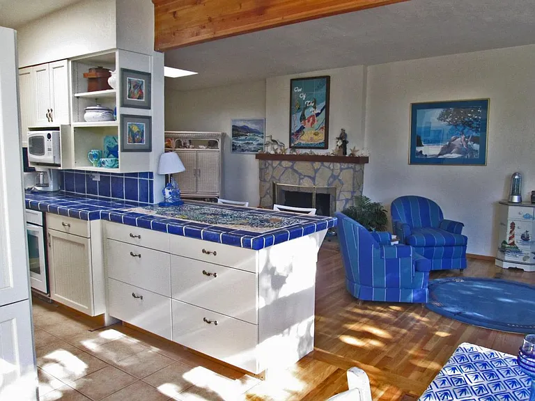 Kitchen opens to counter and living room