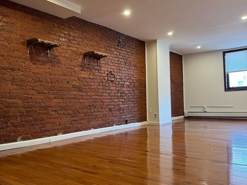 Living room with exposed brick.