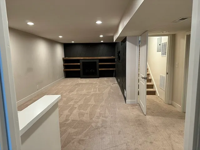 Huge basement view from bedrooms and entertaining wall