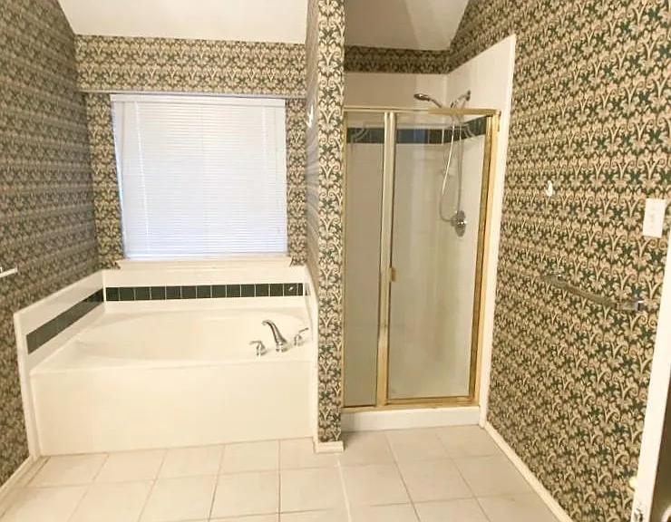 Master Bathroom with large soaking Tub and Stand-in Shower.