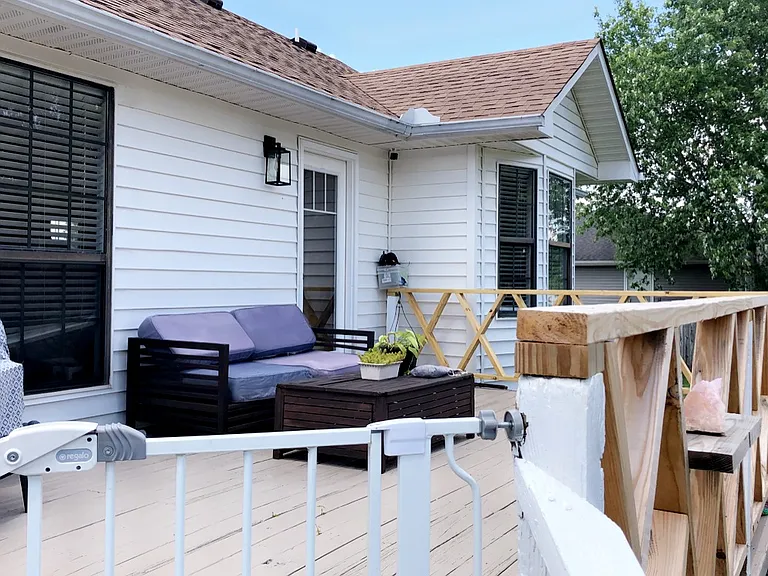 Back porch. Home will have all new windows put in before you move in.