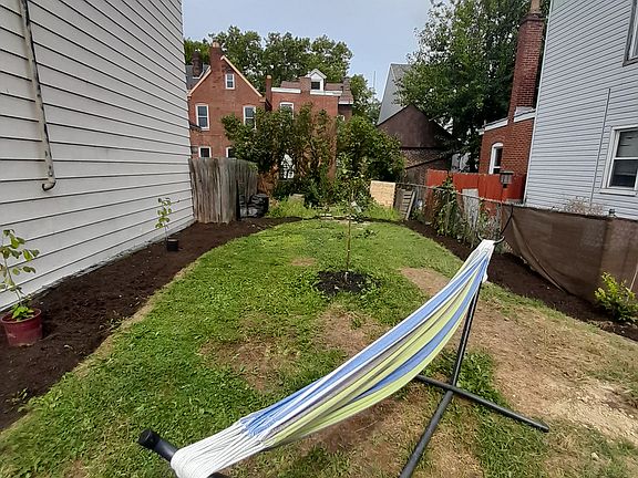 Landscaped yard featuring native plants, 2 apple trees, 2 plum trees, hazelnuts, and pawpaws