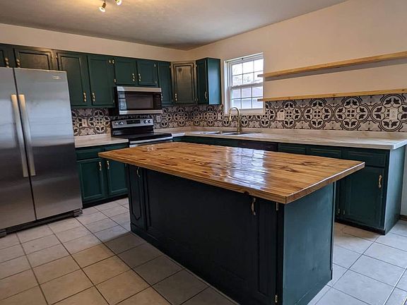 Large kitchen with butcherblock island