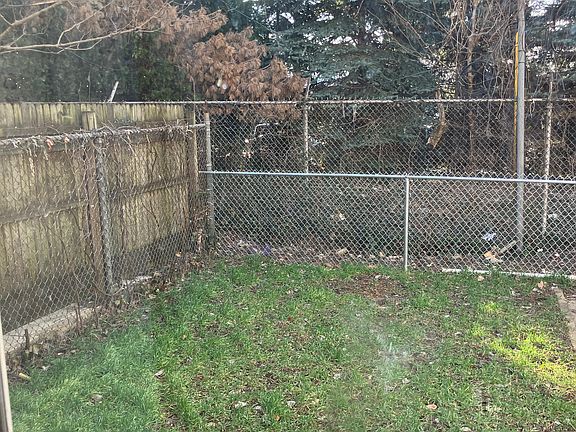 Back yard seen through storm door