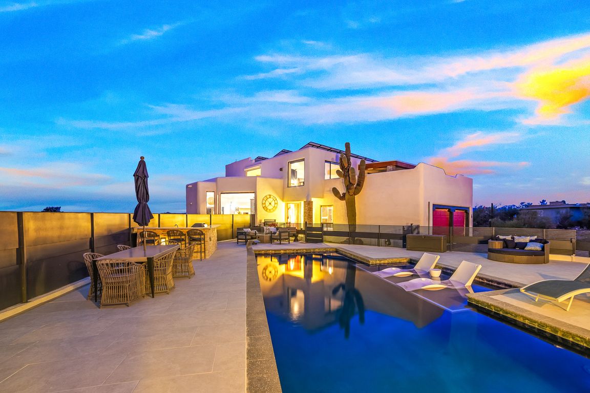 Stunning Backyard Sparkling Pebble Tec Smart Pool, Luxury Outdoor Kitchen & Versatile Patio & Lounge Spaces