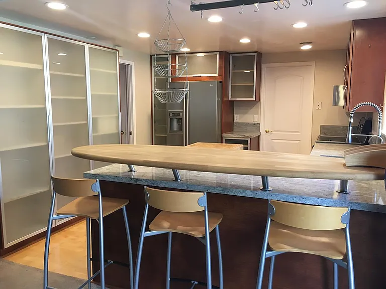 Breakfast bar and view into kitchen