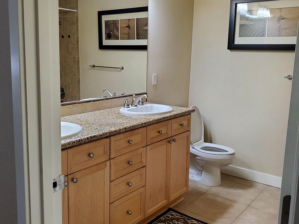 Master Bathroom with two sinks and full bath with tub