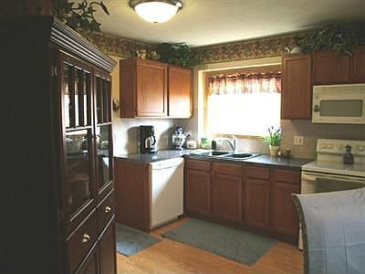 The kitchen has new flooring and countertops.