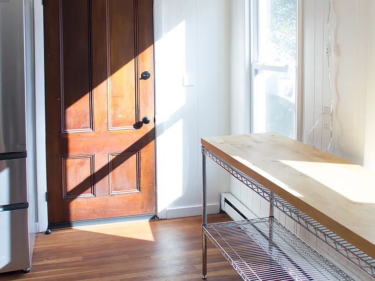 Entry door into kitchen. Eastern facing windows