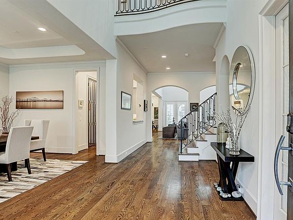 Welcome home! Soaring two story entryway and gleaming hardwoods greet you upon entry to this beautiful French soft contemporary home