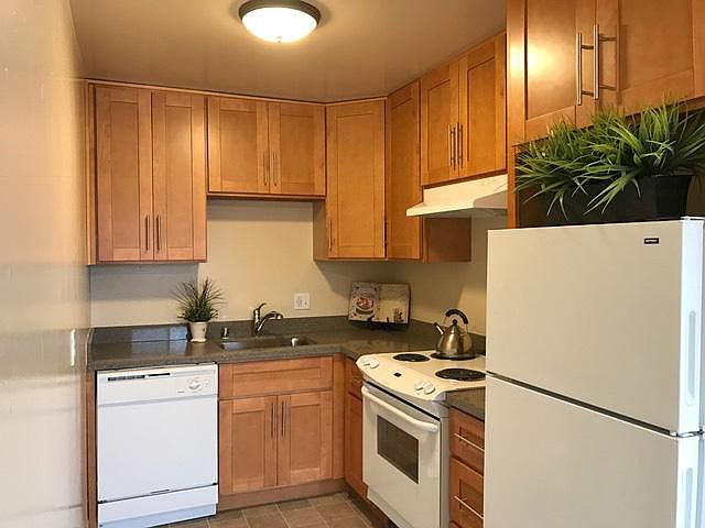 Kitchen with granite countertops and maple cabinets