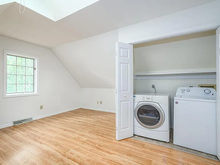 Washer and dryer access for the 3 upstairs bedrooms. Lovely natural light from the skylights