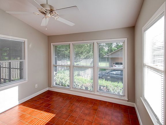 Flex room with lots of windows. Can me dining room, home office or den.