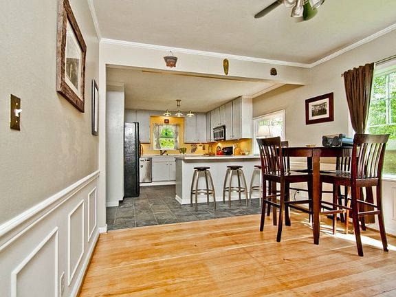 New wainscoting and refinished up floors in Dining Room
