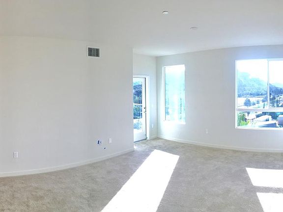 huge living room windows that allow the ocean breeze and fil
