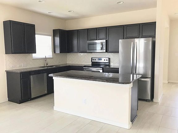 Kitchen with refrigerator, microwave, dishwasher, etc