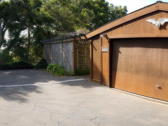 Back of house with extra parking and RV parking and Garage