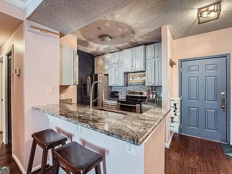 Wrap-around counter space fits two or three stools and diners comfortably.