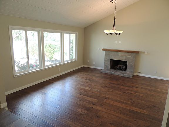 Amazing natural light looking onto front courtyard, Artisan distressed hardwood floors throughout.
