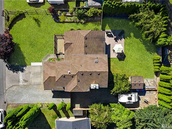 Enjoy lots of time outdoors in your fully fenced backyard with stamped concrete patio, outbuildings, RV parking and mature landscape.  In the front yard enjoy soaking up the sunshine on your deck before entering your freshly updated home