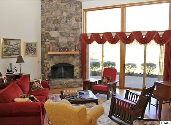 Craftsman home. The great room features cathedral ceilings and tall windows- let the mountain and golf course views inside your house 	