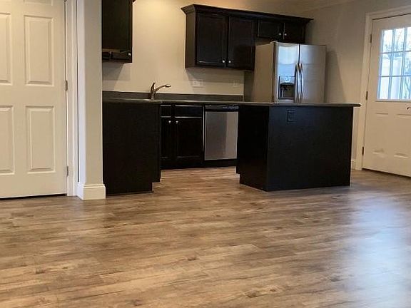 Open floor plan kitchen, living area & dining area