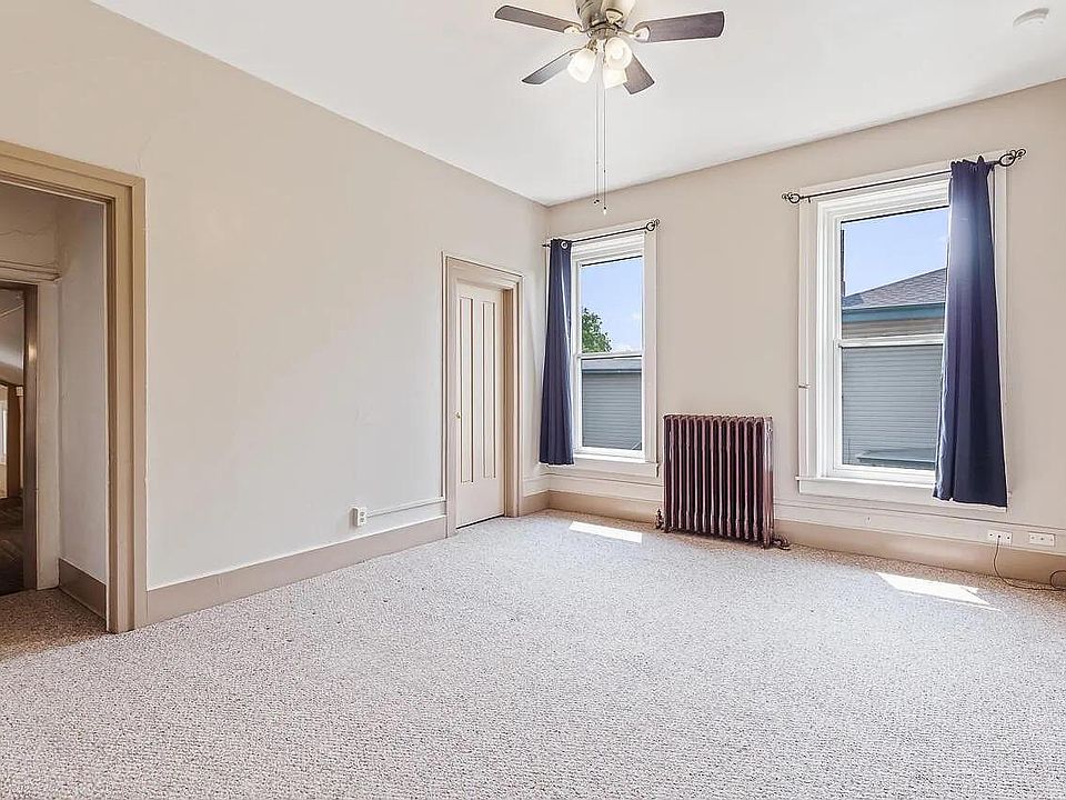 Living area/main room you walk into from stairs