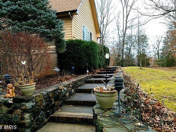 Stone walled walk to front door