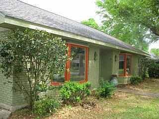 Front of the house-- has since been landscaped, added beds in front