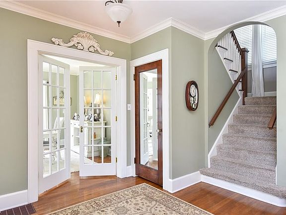 Front Foyer with hardwood flooring. Notice the crown molding!