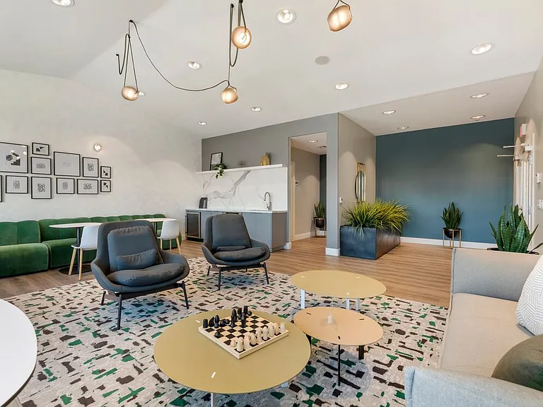 Resident lounge with kitchenette coworking spaces