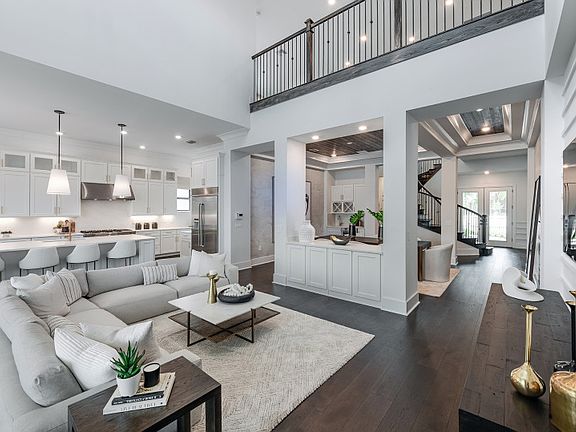 Gathering room with view of loft space overhead
