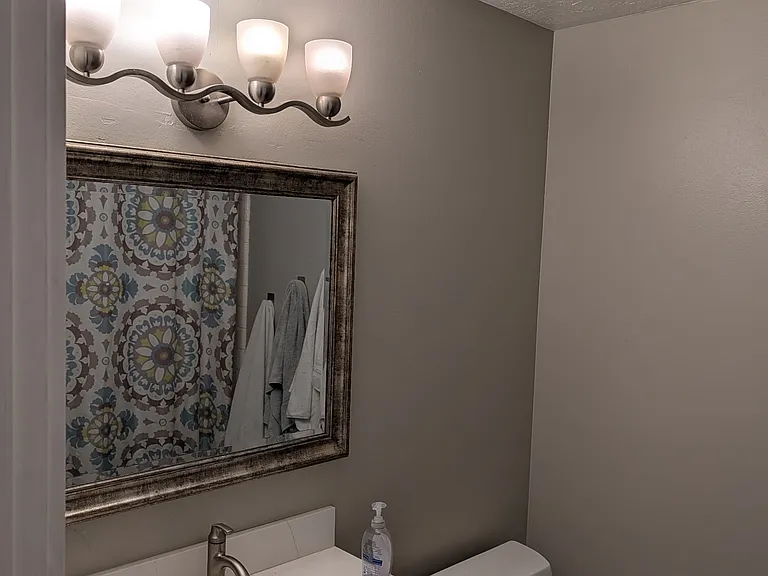 main level bathroom with shower and tub