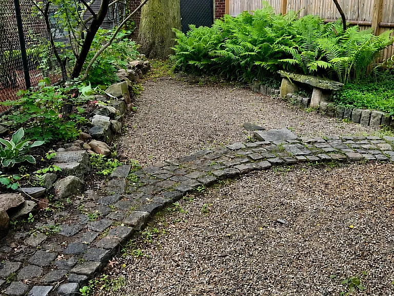 Garden in back of property. Steps from the porch lead into the garden.