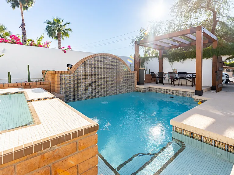 Hot tub, pool and outdoor dinning. Far right is front gate of the property.