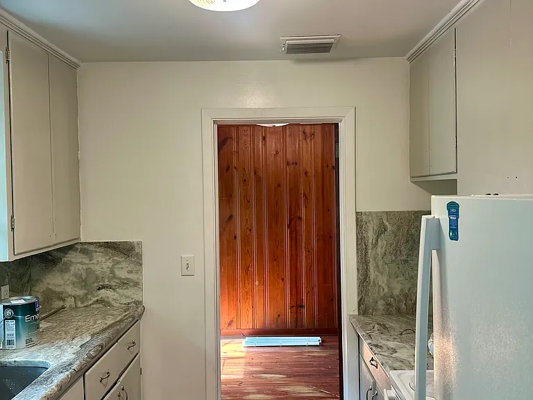 Galley kitchen with granite counter tops