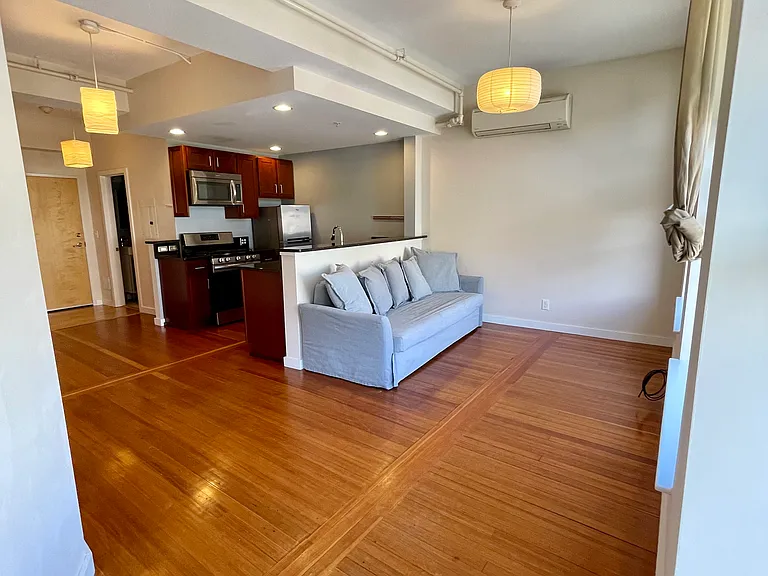 Living room and kitchen from second bedroom door.
