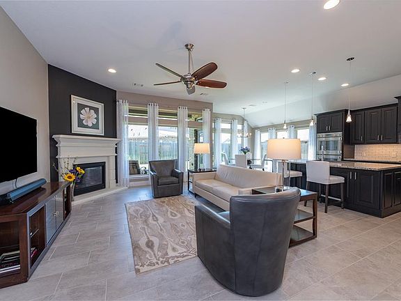As you enter the family room you are greeted with warm elegance--perfect for entertaining family and friends. The family room has tile flooring, a gas-log fireplace and ceiling fan.