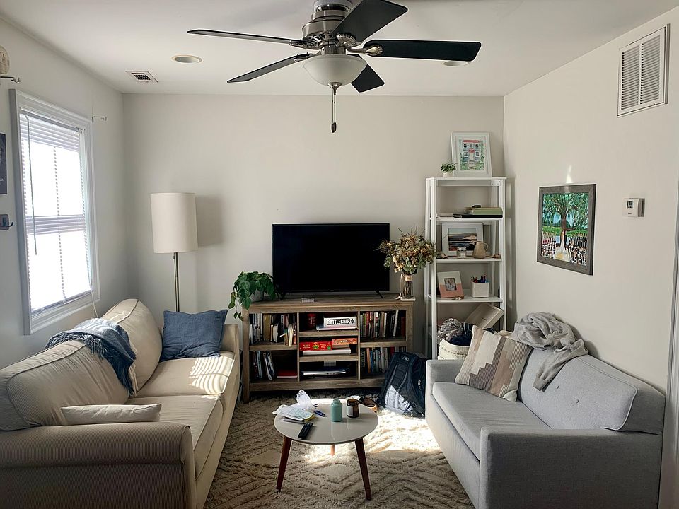 First Floor: Living room with ceiling fan, access to powder room (1/2 bath) and kitchen. The entire unit is painted a light grey. Brazilian Cherry hardwoods throughout first floor.