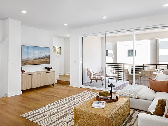 Plan 2B Model Home Bright Living Area Next to Outdoor Deck