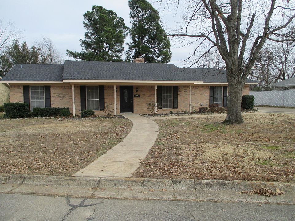 Front of home on large wooded lot