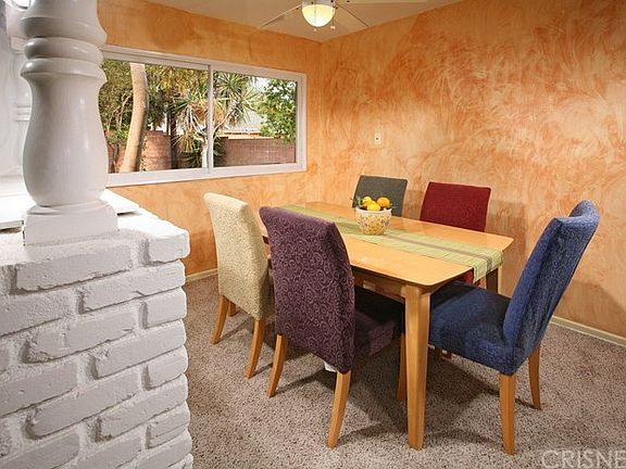 The formal dining room with its large picture wind